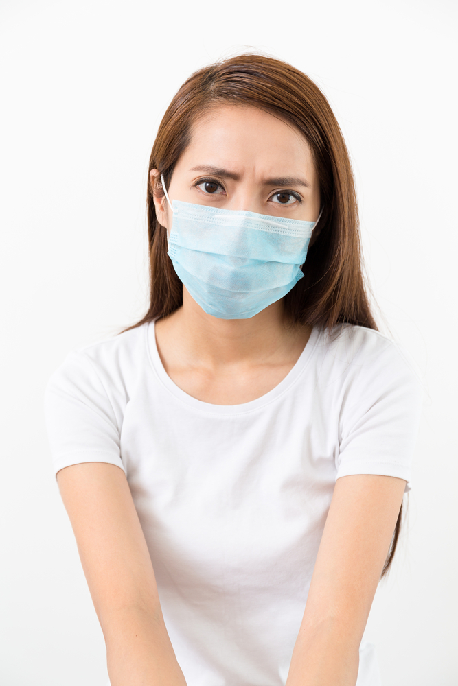 Concerned physician wearing mask